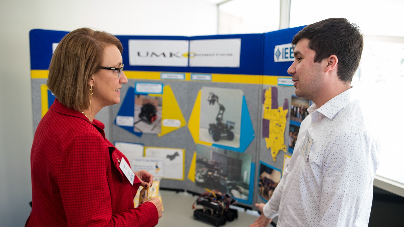 student-demonstrates-engineering-project-to-donor-at-donor-recognition-luncheon.jpg